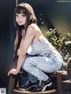 A woman sitting on top of a wooden bench.